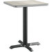 A Lancaster Table & Seating square table with a gray and white reversible top on a metal base.