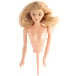 A Wilton doll cake topper with blonde hair on a stick.