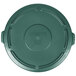 A green Rubbermaid BRUTE lid on a round disc.