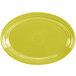 A yellow oval china platter with a white rim.