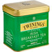 A green and gold Twinings tin of Irish Breakfast loose leaf tea.