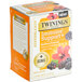 A box of Twinings Immune Support Blackberry, Hibiscus, & Elderberry herbal tea bags on a table.