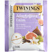 A purple and white package of Twinings Calm Adaptogens Fig & Vanilla Tea Bags with a close-up of a fig fruit.
