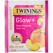 A pink and white Twinings Superblends Glow+ Peach & Aloe Vera tea packet with a pink label.