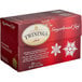 A red box of Twinings Gingerbread Joy Tea Bags with white text and snowflakes on it.