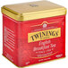 A red and gold Twinings English Breakfast loose leaf tea tin.