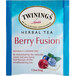A blue and white box of Twinings Berry Fusion herbal tea bags.