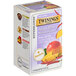 A box of Twinings Boost Adaptogens Mango Chili Chai tea bags with fruit on it.