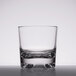 A close-up of a clear plastic GET Roc N' Roll Old Fashioned glass with a low rim.