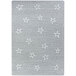 A grey rug with white stars on it.