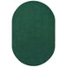 An oval forest green rug with a white border.