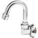 A T&S chrome wall mounted faucet with a swivel gooseneck spout.