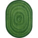 A green oval rug with a spiral pattern.