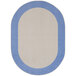 A light blue oval rug with a white border and blue accents.
