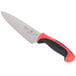 A Mercer Culinary Millennia Colors chef knife with a red handle.