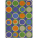 A Joy Carpets rectangle area rug with colorful circles on a blue background.
