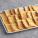 A tray of Papetti's Cinnamon Swirl French Toast on a counter.