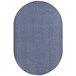 An oval grey rug with a dark blue center.