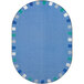 A blue oval rug with a white and blue border.