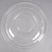 A clear plastic container lid on a clear plastic bowl.