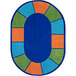 A close-up of a Joy Carpets multicolored oval rug with a blue, orange, and green border.