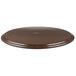 A brown oval Carlisle non skid serving tray.