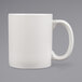 A white Tuxton china mug with a white handle.