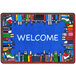 A multicolored rectangular area rug with a blue welcome sign and books on it.