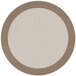 A white and beige round area rug with a border on a white and brown table.