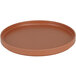 A round brown Cal-Mil Hudson Terra Cotta melamine plate with a low rim.