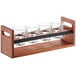 A wooden Acopa flight carrier with 4.5 oz. espresso glasses in glass holders.