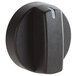 A black plastic Carnival King temperature dial knob with a white stripe and a small hole in it.