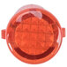 A close up of a red round indicator light with a white background.