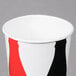 A white Solo paper cold cup with a red and black design.