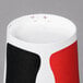 A close up of a red and white Solo paper cold cup with a black stripe.