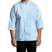 A man wearing a Uncommon Chef sky blue 3/4 sleeve chef coat.