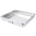A silver aluminum Vollrath commercial roasting pan with handles.