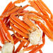 A pile of orange Chesapeake Crab Connection Extra Large snow crab legs.