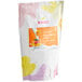 A white bag of Bossen Mango Milk Tea Powder with a label.