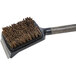 A Louisiana Grills Palmyra cleaning brush with a handle and brown bristles.