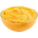 A bowl of yellow Kaukauna Sharp Cheddar Cheese Spread.