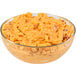 A glass bowl of Price's Pimento Cheese Spread on a table in a deli.