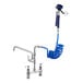 A Waterloo pet grooming faucet with blue hose and sprayer attached.