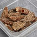 A plastic container of dried Morel mushrooms.