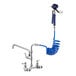 A white Waterloo pet grooming faucet with a blue coiled hose attached.
