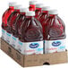 A cardboard box holding 8 plastic bottles of Ocean Spray Cranberry + Health Juice.