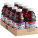 A group of bottles of Ocean Spray Pure Cranberry Juice in a cardboard box.