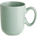 A close-up of an Acopa Harbor Blue matte porcelain cup with a handle.