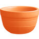 An orange stoneware bouillon cup with an orange rim.