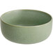 An Acopa Pangea sage matte porcelain bowl with a white rim.